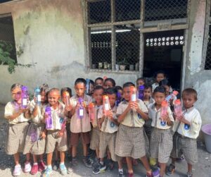 Class with water bottles featuring ceramic water filters do we have consent to use these photos