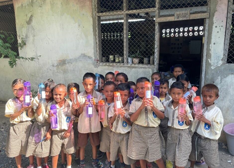 Class with water bottles featuring ceramic water filters do we have consent to use these photos