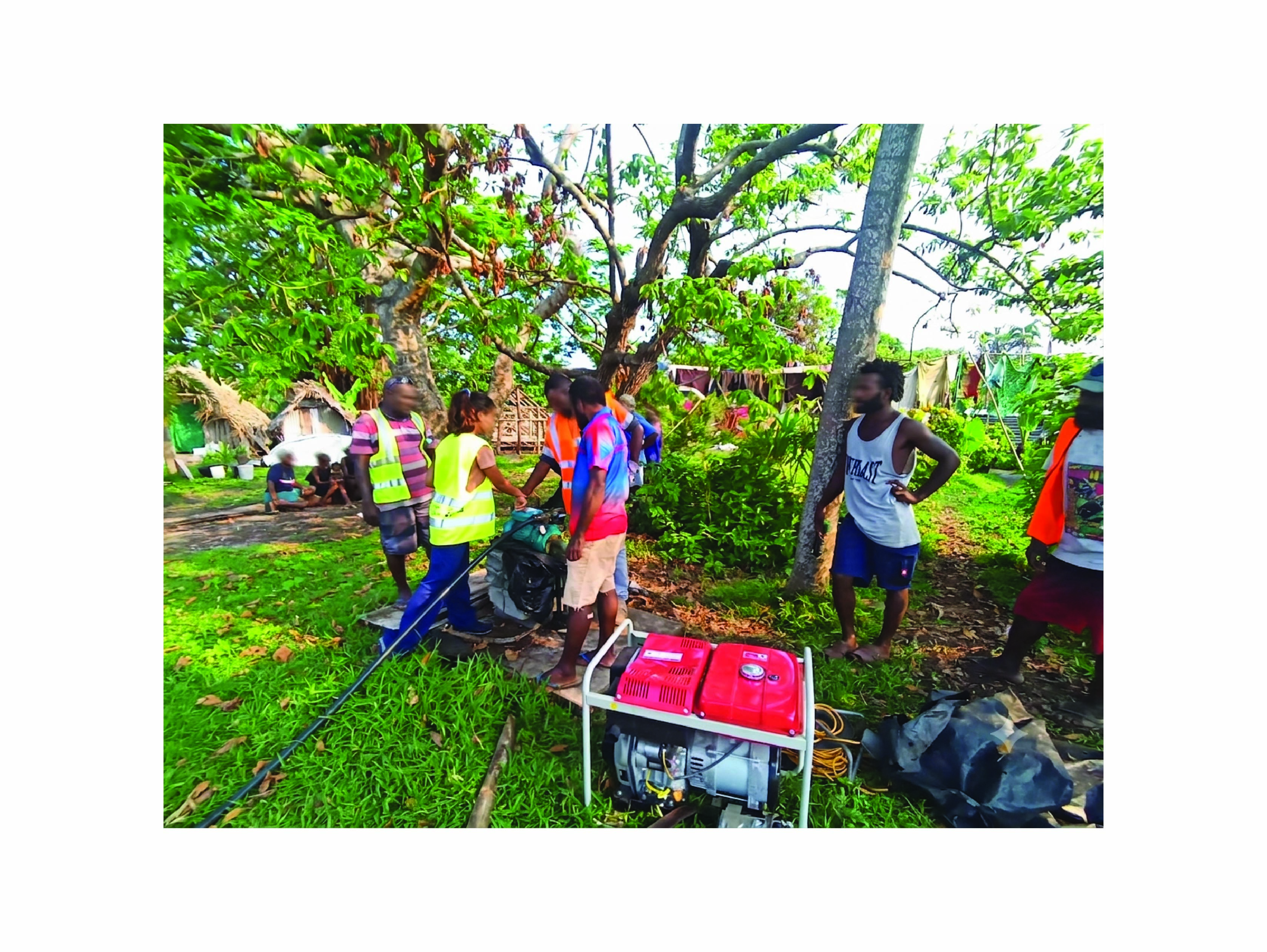Sadia and her colleagues troubleshooting a hand pump in a Vanuatu community to restore water access.
